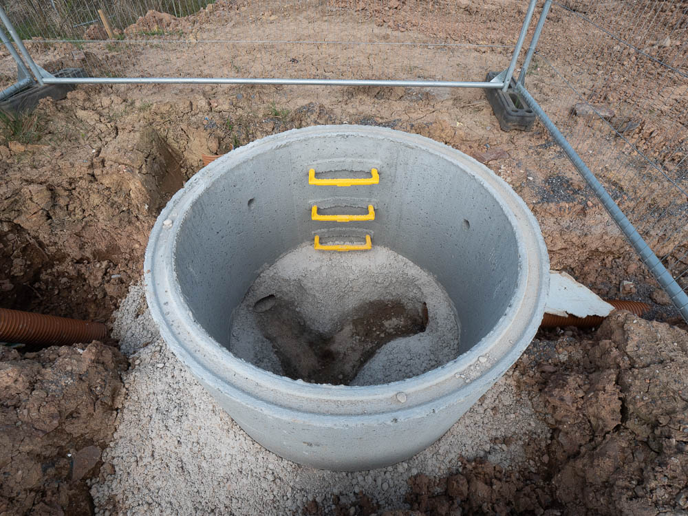 Precast concrete inspection chamber installed during drainage groundworks