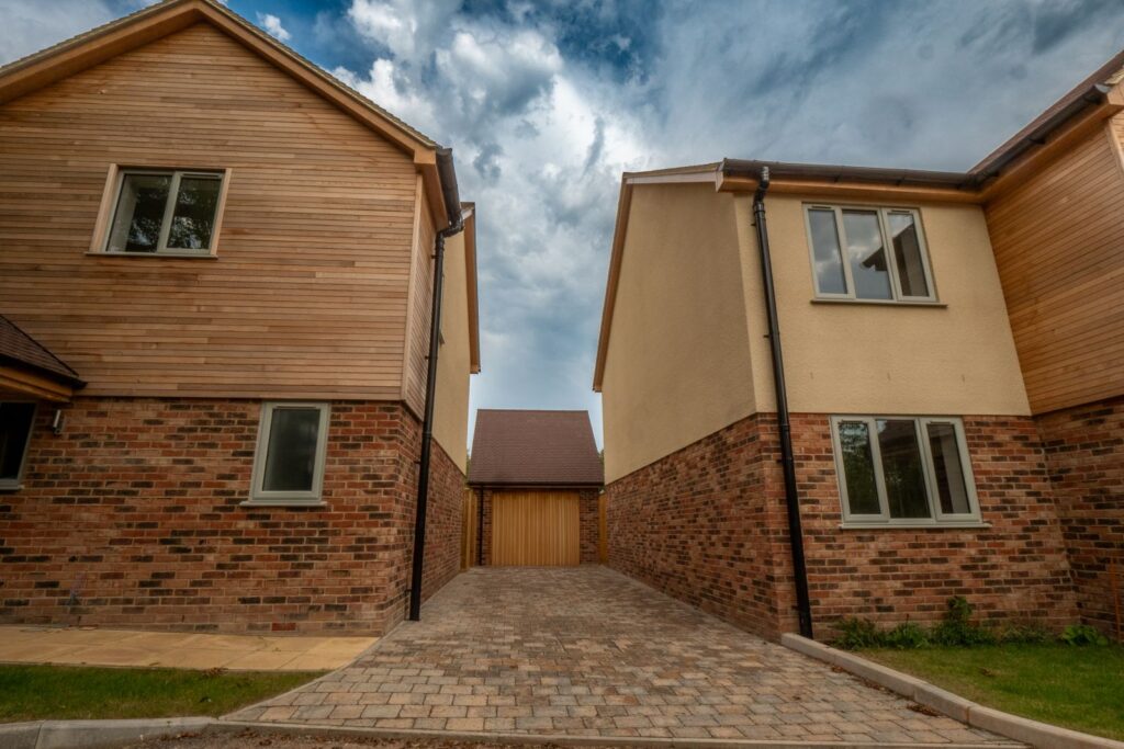 Finished block-paved access driveway serving new-build homes in Gloucestershire.