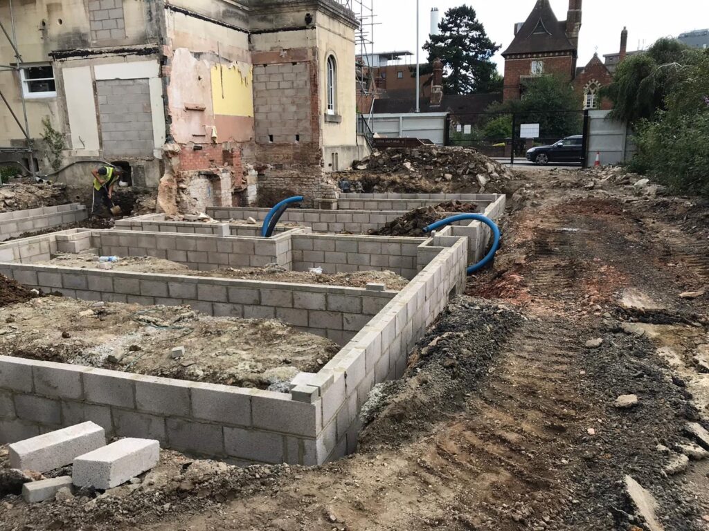 Blockwork substructure built up from foundations.