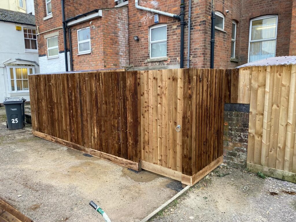 Closeboard timber fencing around a residential rear yard.