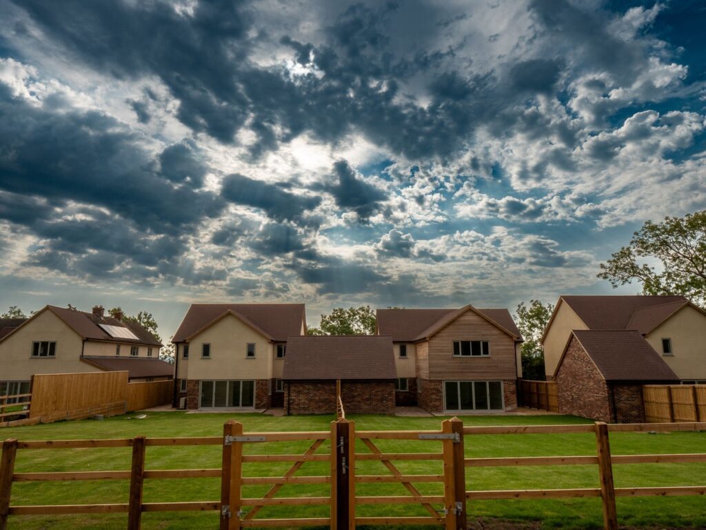 New timber gate and boundary fencing border finished homes on a Gloucestershire development.