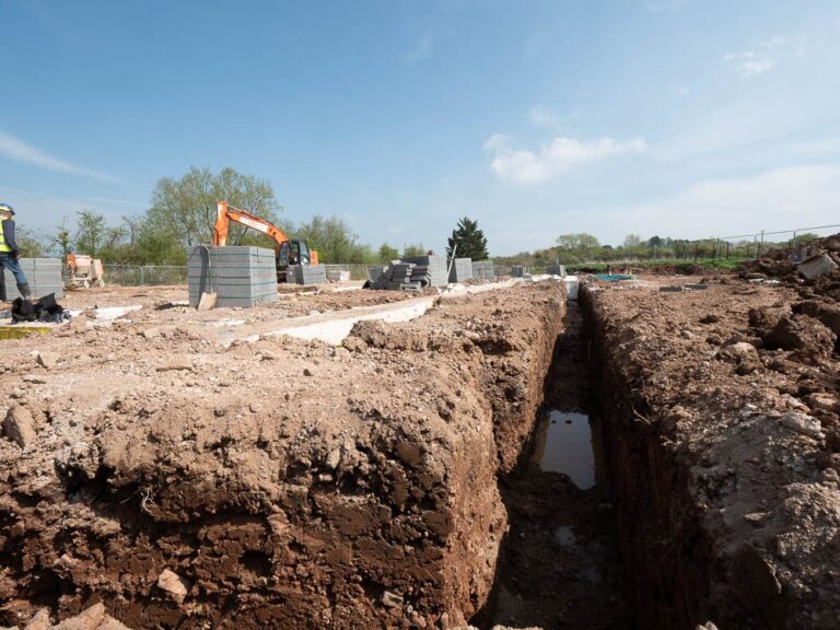 Excavated foundation trench on a residential development site.