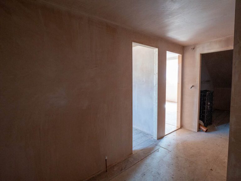 Freshly plastered room during a house renovation.