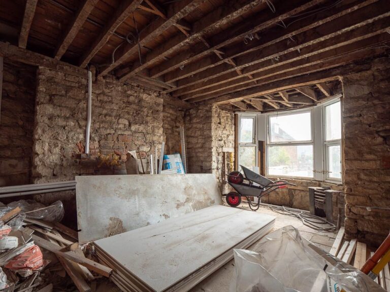 Interior renovation with new stud walls and boarding.