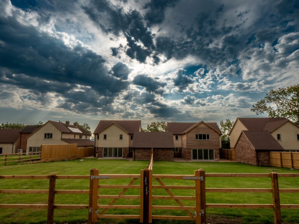Completed homes and timber boundary fencing on a Gloucestershire housing development.