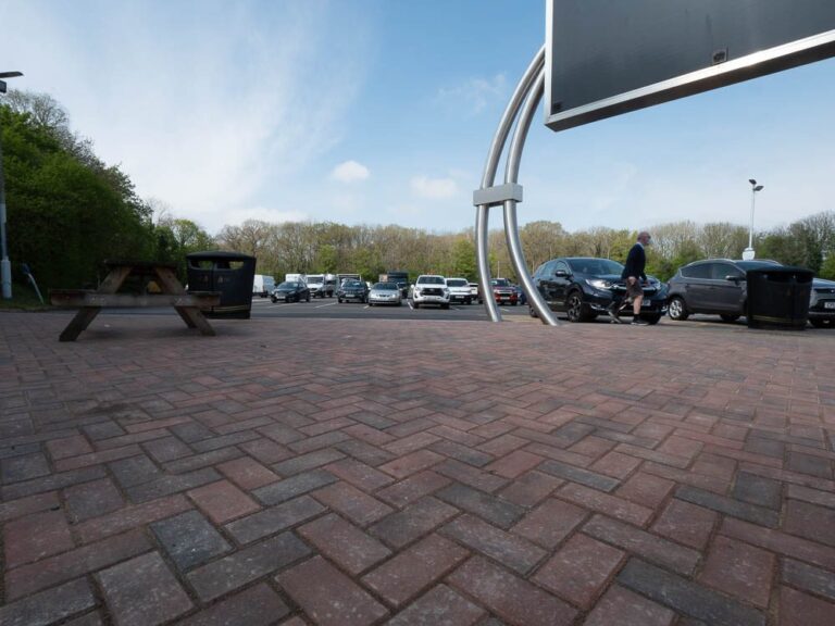 Close view of a block-paved forecourt at Moto Leigh Delamere Services.