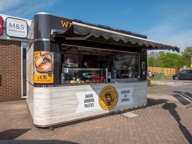 Food kiosk on block paving outside Moto Leigh Delamere Services.
