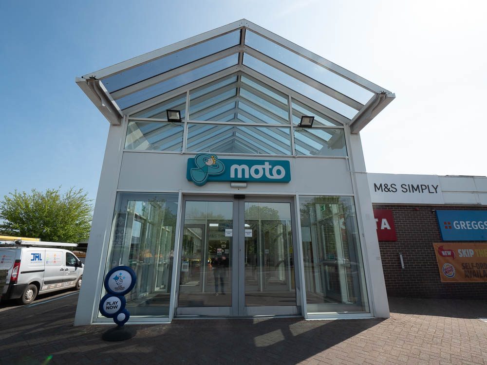 Main entrance building at Moto Leigh Delamere Services in Chippenham.