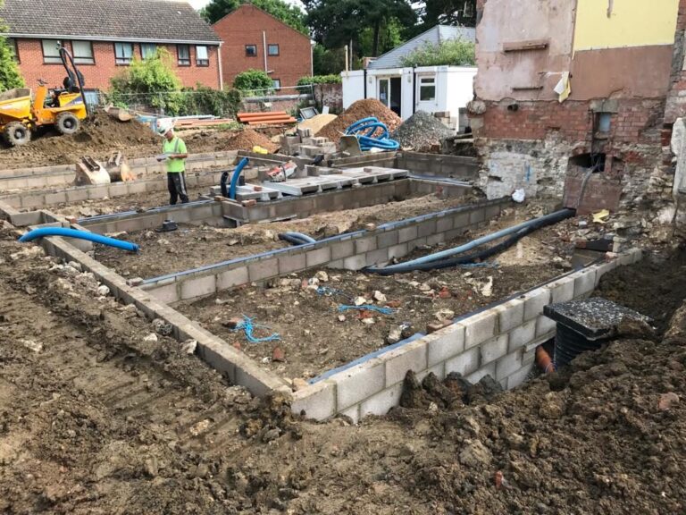 Substructure with drainage pipework on a new-build site.